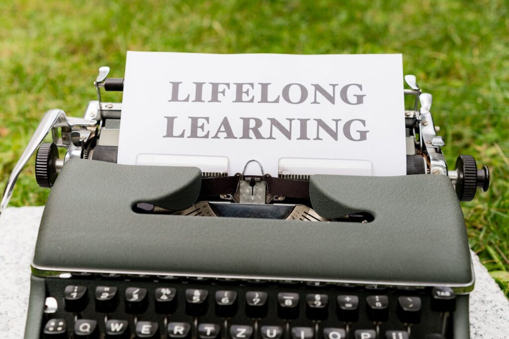 A typewriter with a paper that says life long learning